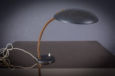 A BLACK METAL EXECUTIVE LAMP by Louis Kalff  at deVeres Auctions