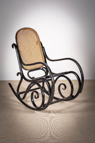 AN EBONISED AND  BERGERES ROCKING CHAIR at deVeres Auctions