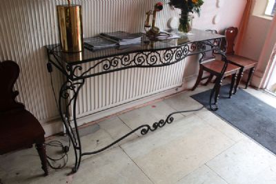 A METAL BOW FRONTED CONSOLE TABLE at deVeres Auctions