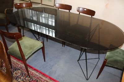 A SMOKED GLASS DINING TABLE at deVeres Auctions