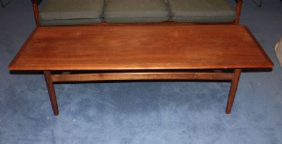 A TEAK COFFEE TABLE at deVeres Auctions