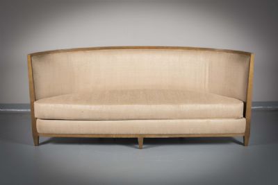 A CRESCENT SHAPED UPHOLSTERED SOFA, by Andree Putman  at deVeres Auctions