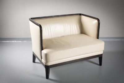 A LEATHER UPHOLSTERED TWO SEAT CHAIR BACK SOFA by Andree Putman sold for €950 at deVeres Auctions