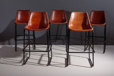 A SET OF FIVE INDUSTRIAL LEATHER BAR/KITCHEN ISLAND STOOLS, by ROCKET ST. GEORGE sold for €1,000 at deVeres Auctions