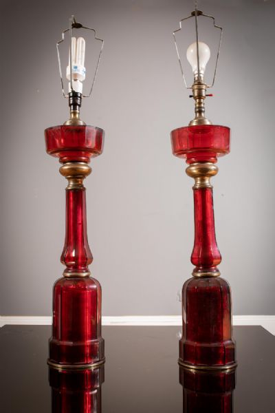 A PAIR OF RUBY GLASS AND BRASS MOUNTED FACETTED TABLE LAMPS at deVeres Auctions