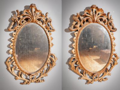 A PAIR OF GILTWOOD OVAL WALL MIRRORS IN ROCOCO STYLE at deVeres Auctions