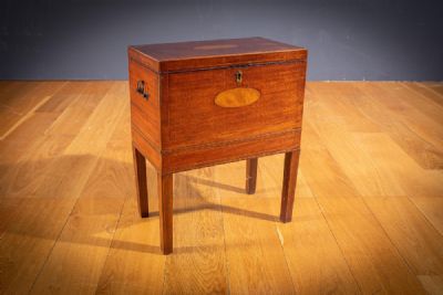 A MAHOGANY AND INLAID CELLARETTE, 19TH CENTURY at deVeres Auctions