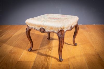 A Victorian mahogany footstool, by Robert Strahan sold for €440 at deVeres Auctions
