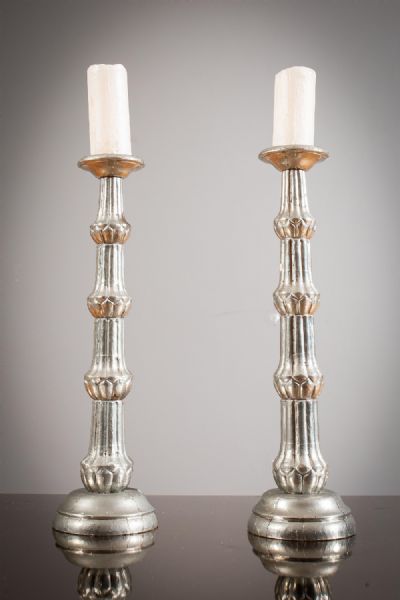 A PAIR OF SILVERED CANDLESTICKS at deVeres Auctions