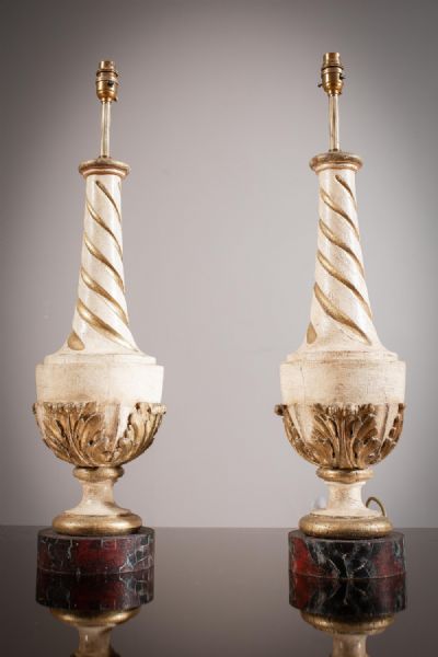A PAIR OF CREAM AND GILT PAINTED WOODEN BALUSTER SHAPED LAMPS at deVeres Auctions
