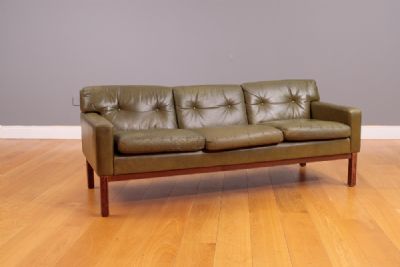 A GREEN LEATHER UPHOLSTERED CLUB SOFA, 1970's at deVeres Auctions