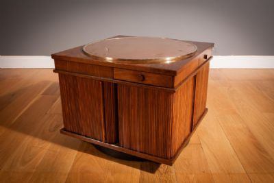 A WALNUT REVOLVING BAR, ITALIAN 1960s, by Gianfranco Frattini sold for €1,700 at deVeres Auctions