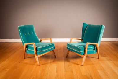 A PAIR OF GREEN UPHOLSTERED 'HIS & HERS' EASY CHAIRS at deVeres Auctions