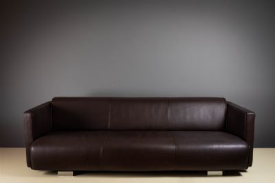 A BROWN LEATHER 6300 SOFA, STOOL AND ARMCHAIR by ROLF BENZ  at deVeres Auctions