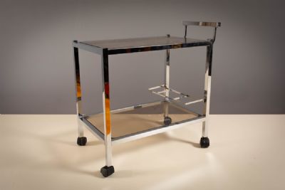 A CHROME ART DECO STYLE COCKTAIL TROLLEY, 1970s at deVeres Auctions