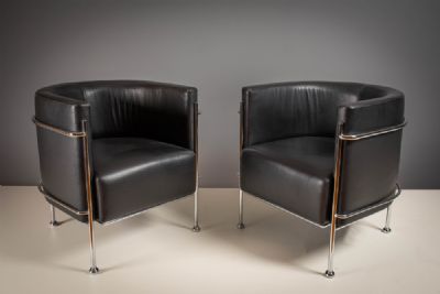 A PAIR OF BLACK LEATHER AND CHROME FRAMED TUB CHAIRS, by CORINTO, sold for €420 at deVeres Auctions