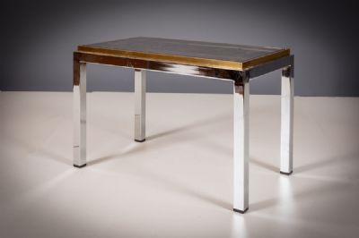 A CHROME AND GILT SIDE TABLE at deVeres Auctions