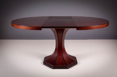 A ROSEWOOD DINING TABLE at deVeres Auctions