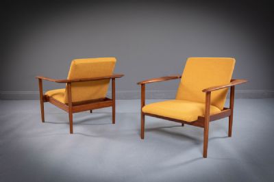 A PAIR OF TEAK ARMCHAIRS at deVeres Auctions