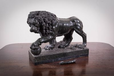 16 by A GREEN MARBLE MODEL OF A LION  at deVeres Auctions